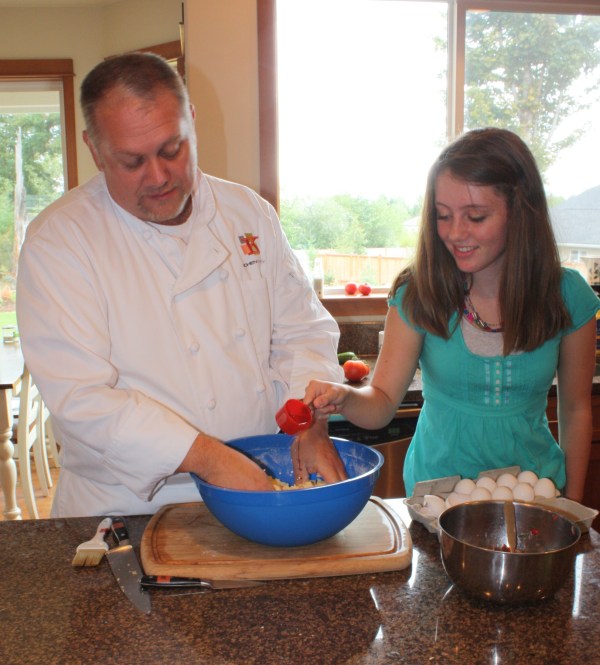 Amanda's turn, adding moisture to the pasta dough